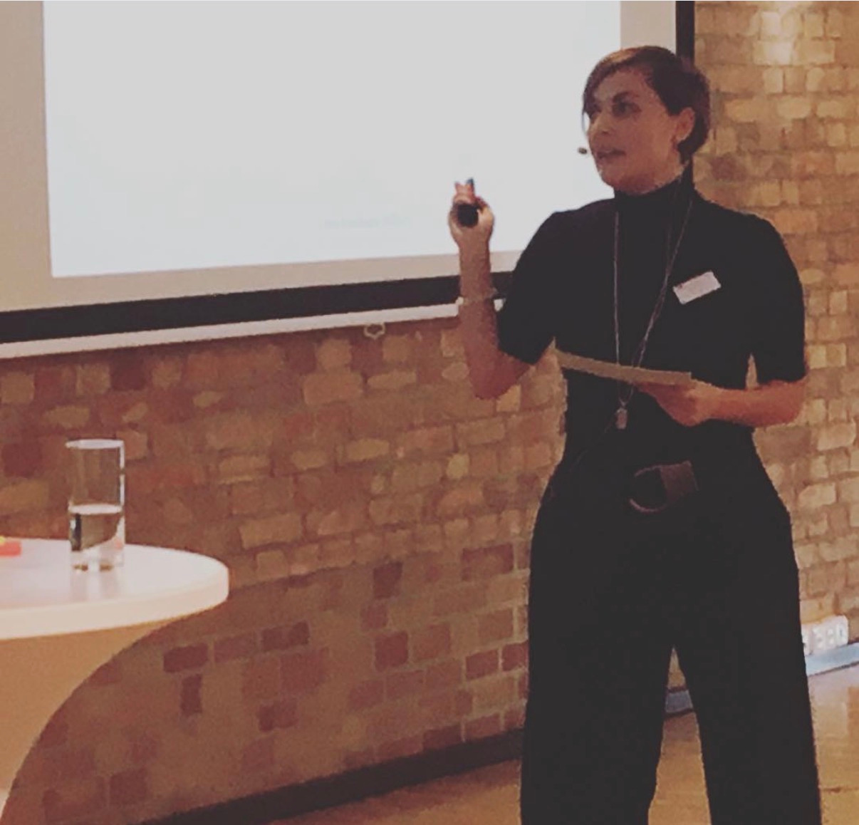 Dr. Nea Krivokapa-Williams presenting on stage